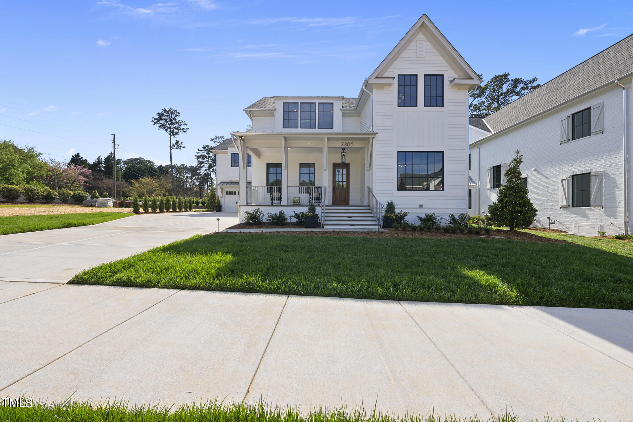 3305 Founding Place Raleigh, NC 27612 - Photo 5 of 100 a front view of a house with a yard and trees