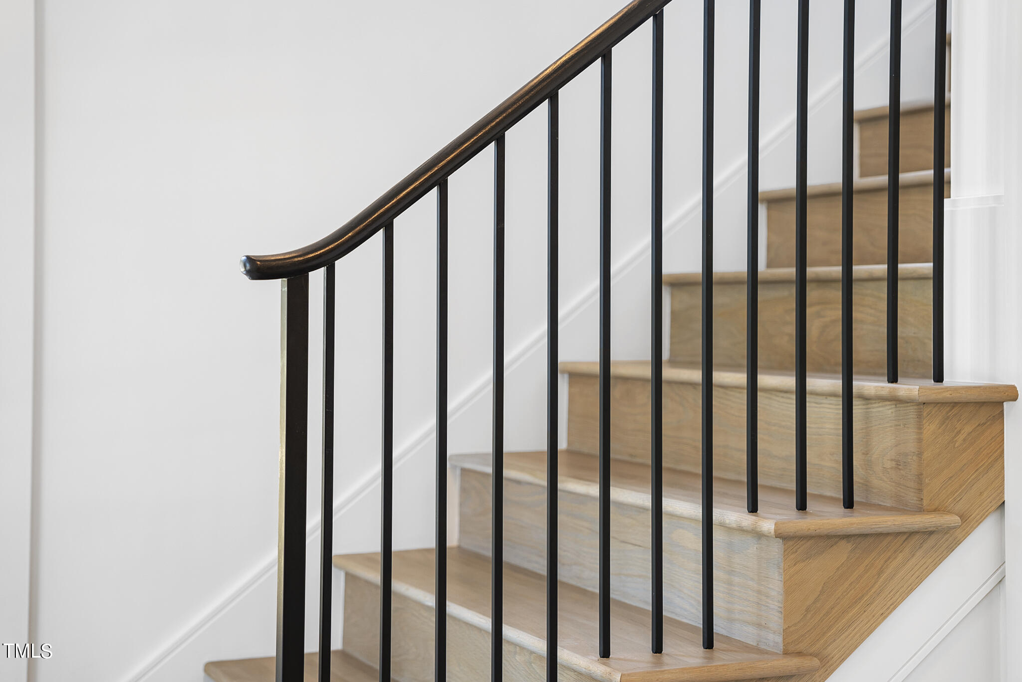 3305 Founding Place Raleigh, NC 27612 - Photo 58 of 100 a view of staircase with railing and white walls