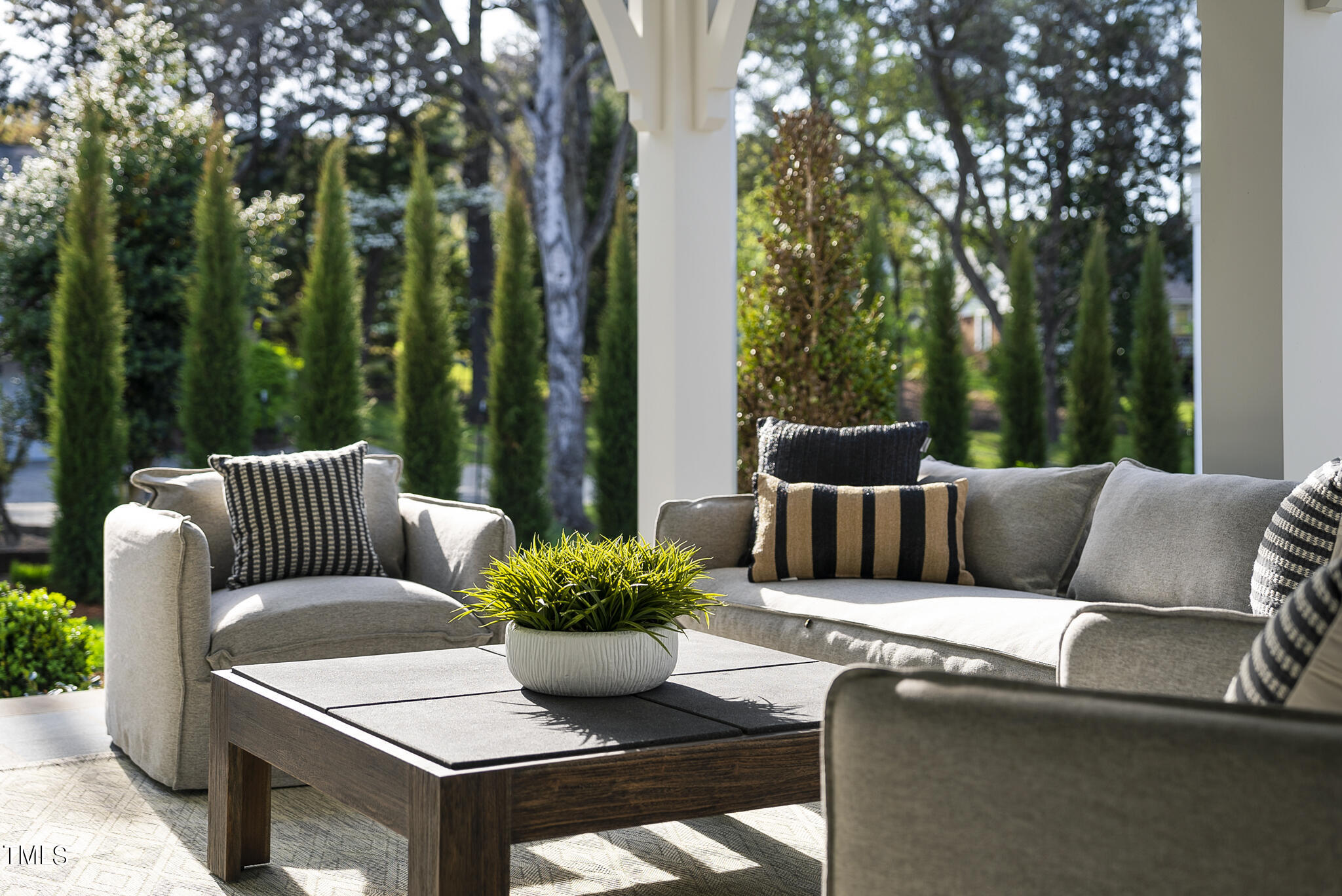 3305 Founding Place Raleigh, NC 27612 - Photo 75 of 100 a view of a patio with couches table and chairs and potted plants