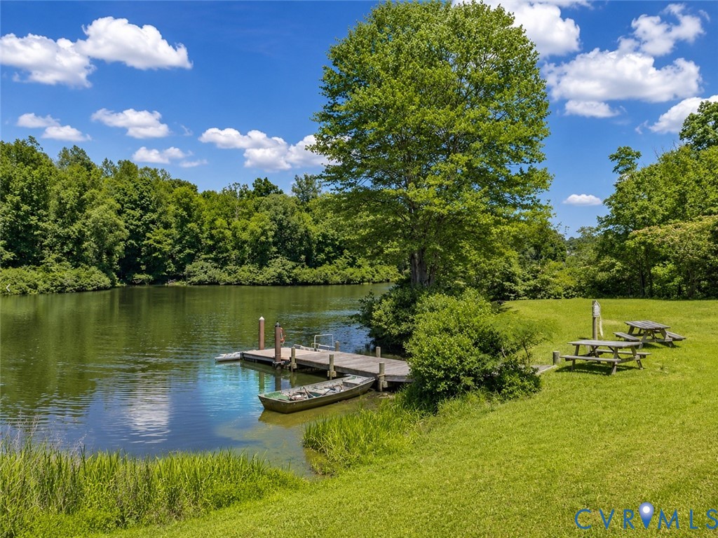 80 Mill Ridge Road Hartfield, VA 23071 - Photo 34 of 43 Expansive grassy bank with mature trees, a private