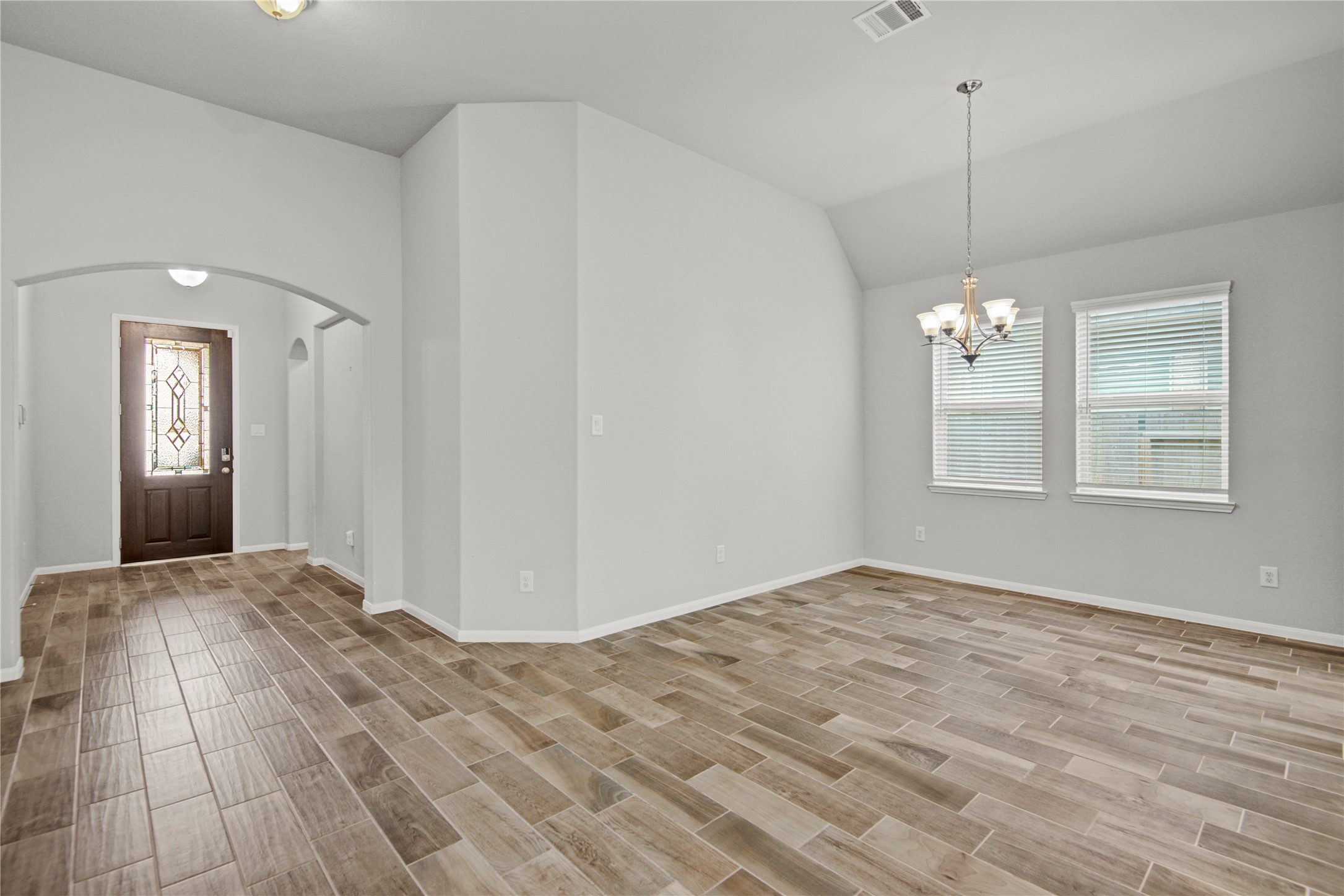 1314 Orchard Ridge Lane Tomball, TX 77375 - Photo 9 of 35 The formal dining room offers an elegant setting with natural light and an open connection to the heart of the home.