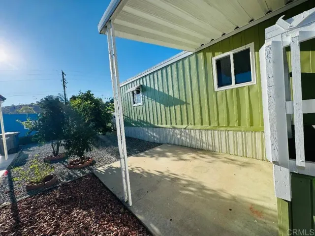 a view of a porch with a small yard
