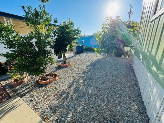 a backyard of a house with lots of green space