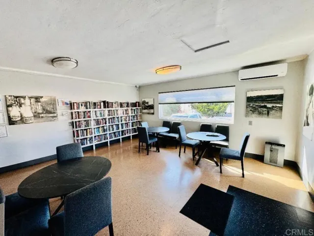 a view of a livingroom with furniture and a flat screen tv