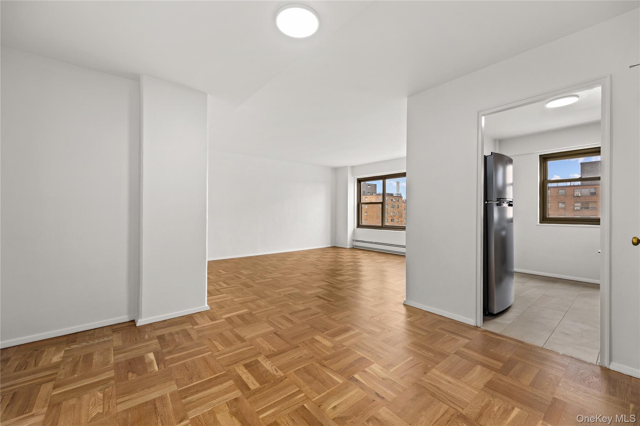 21-66 33rd Road, Unit 12B Queens, NY 11106 - Photo 11 of 23 a view of an empty room and window