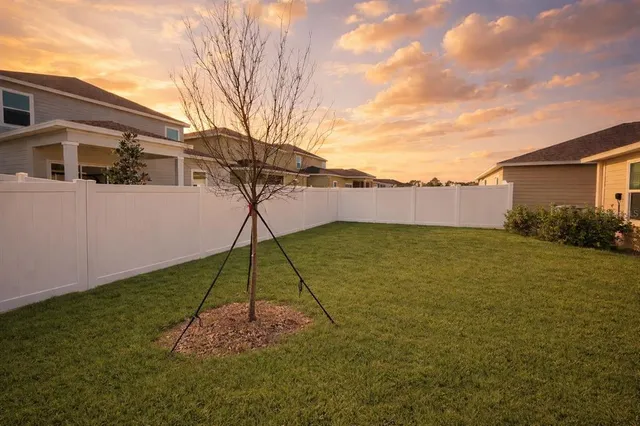 a backyard of a house with lots of green space