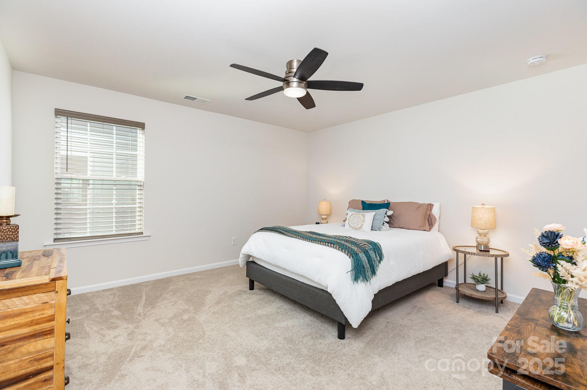 1659 Loggerhead Drive Lancaster, SC 29720 - Photo 19 of 29 a spacious bedroom with a bed and a window
