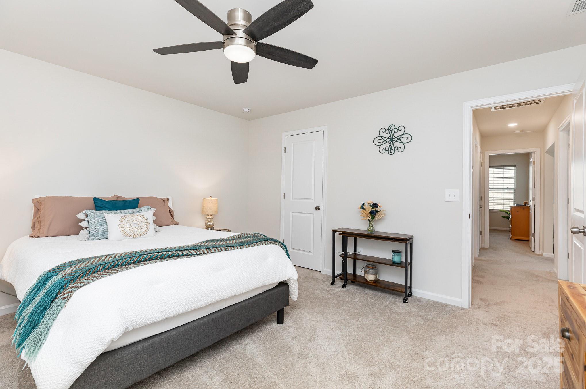 1659 Loggerhead Drive Lancaster, SC 29720 - Photo 20 of 29 a bed room with a bed and a chandelier