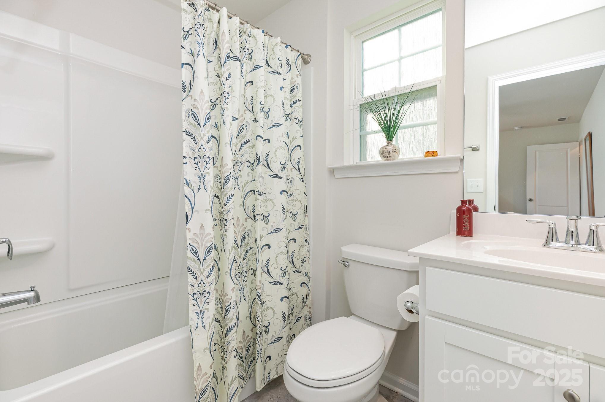 1659 Loggerhead Drive Lancaster, SC 29720 - Photo 21 of 29 a bathroom with a toilet a sink and a bath tub