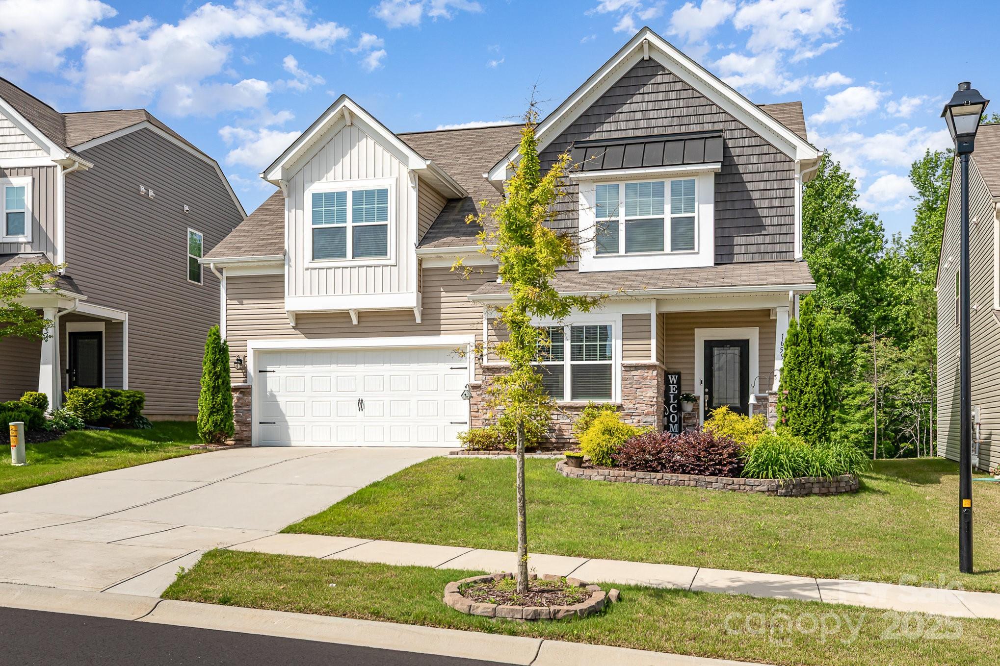 1659 Loggerhead Drive Lancaster, SC 29720 - Photo 27 of 29 a front view of a house with a yard and garage