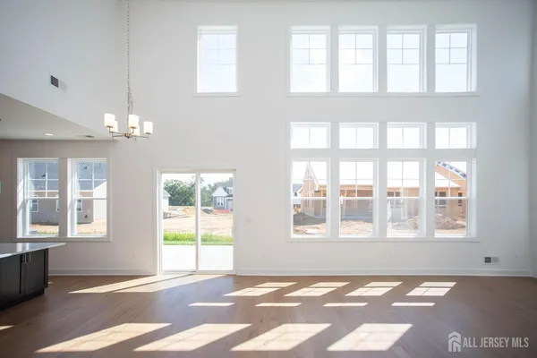 a view of a kitchen with a sink and a large window