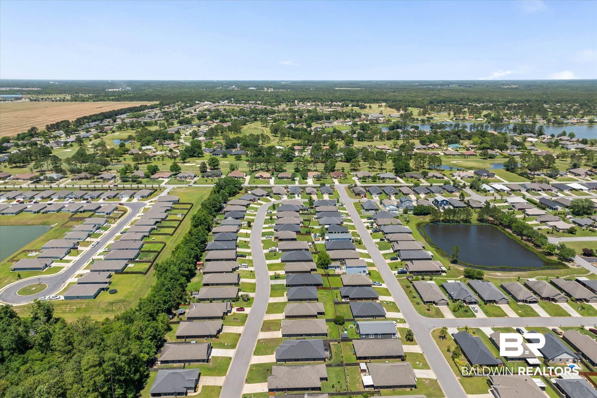 22420 Respite Lane Foley, AL 36535 - Photo 34 of 35 Aerial perspective of a planned residential community featuring numerous single-story homes with dark roofs