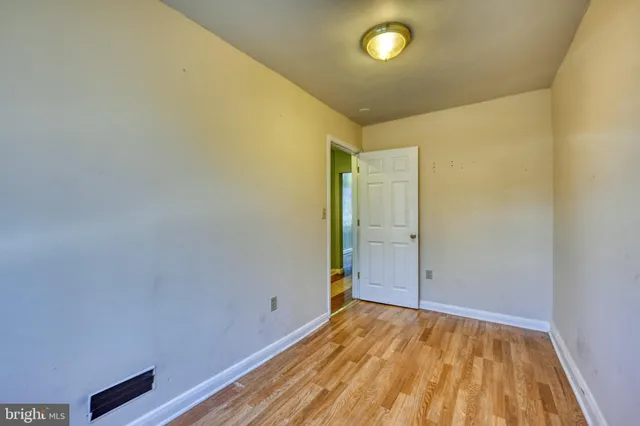 a view of room with wooden floor