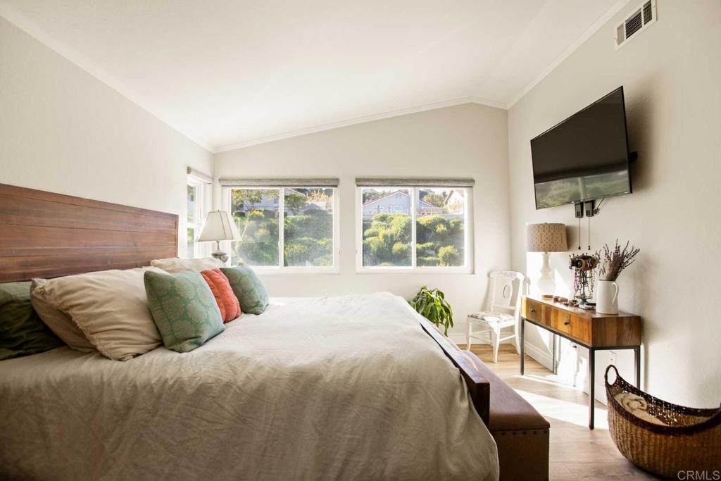 381 Via Almansa Encinitas, CA 92024 - Photo 18 of 32 a bedroom with a bed and a flat screen tv