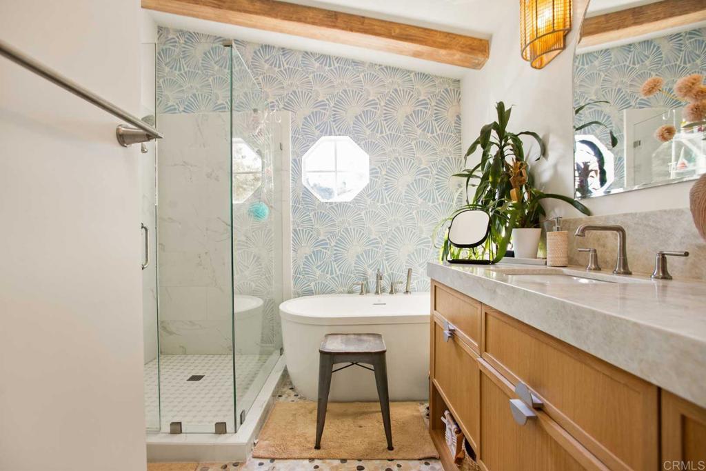 381 Via Almansa Encinitas, CA 92024 - Photo 19 of 32 a bathroom with a sink a mirror and a shower