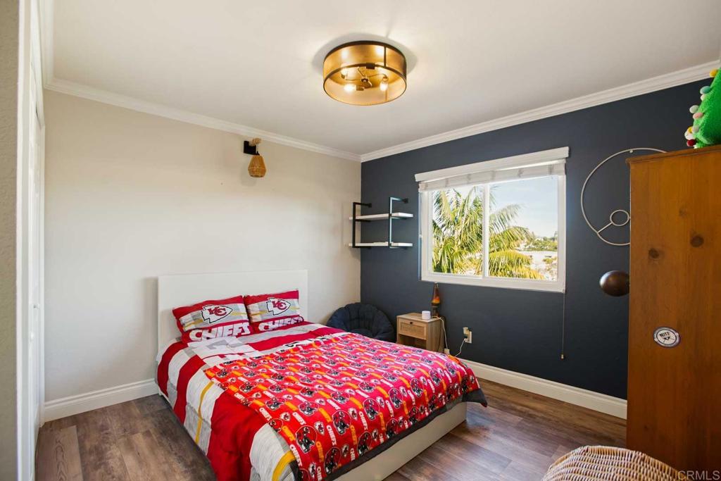 381 Via Almansa Encinitas, CA 92024 - Photo 22 of 32 a bedroom with a bed and painting on the wall