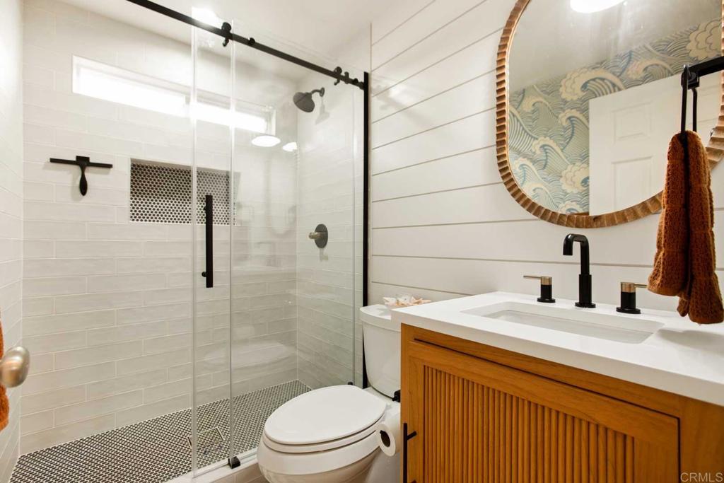 381 Via Almansa Encinitas, CA 92024 - Photo 23 of 32 a bathroom with a sink toilet and shower