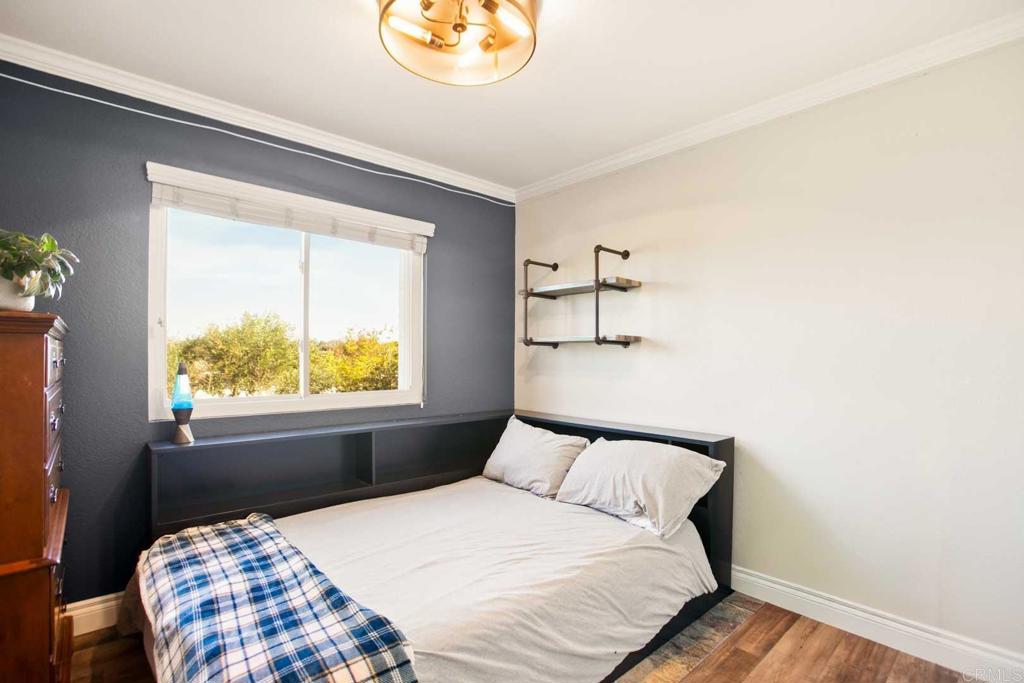 381 Via Almansa Encinitas, CA 92024 - Photo 27 of 32 a bedroom with a bed and a window