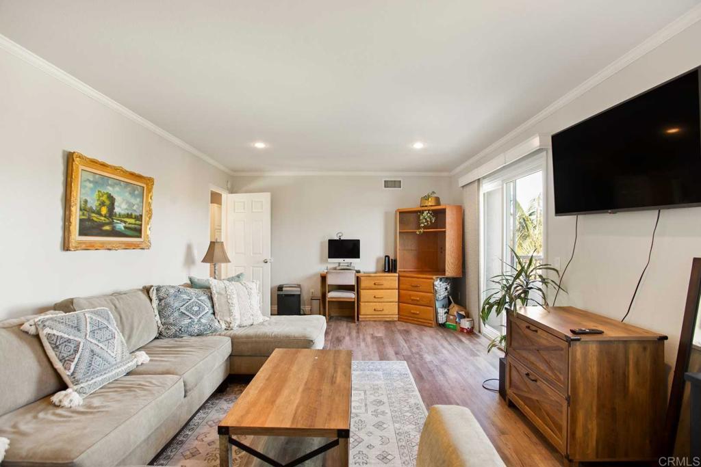 381 Via Almansa Encinitas, CA 92024 - Photo 29 of 32 a living room with furniture and a flat screen tv
