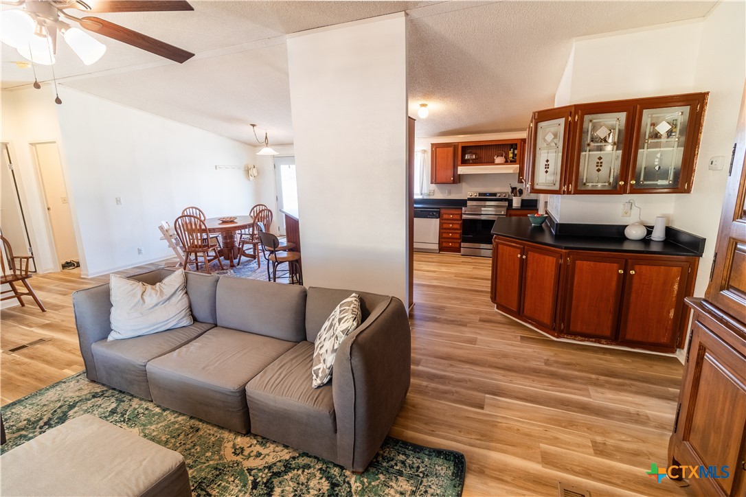 250 Rocky Road Lockhart, TX 78644 - Photo 12 of 45 a living room with furniture and a wooden floor