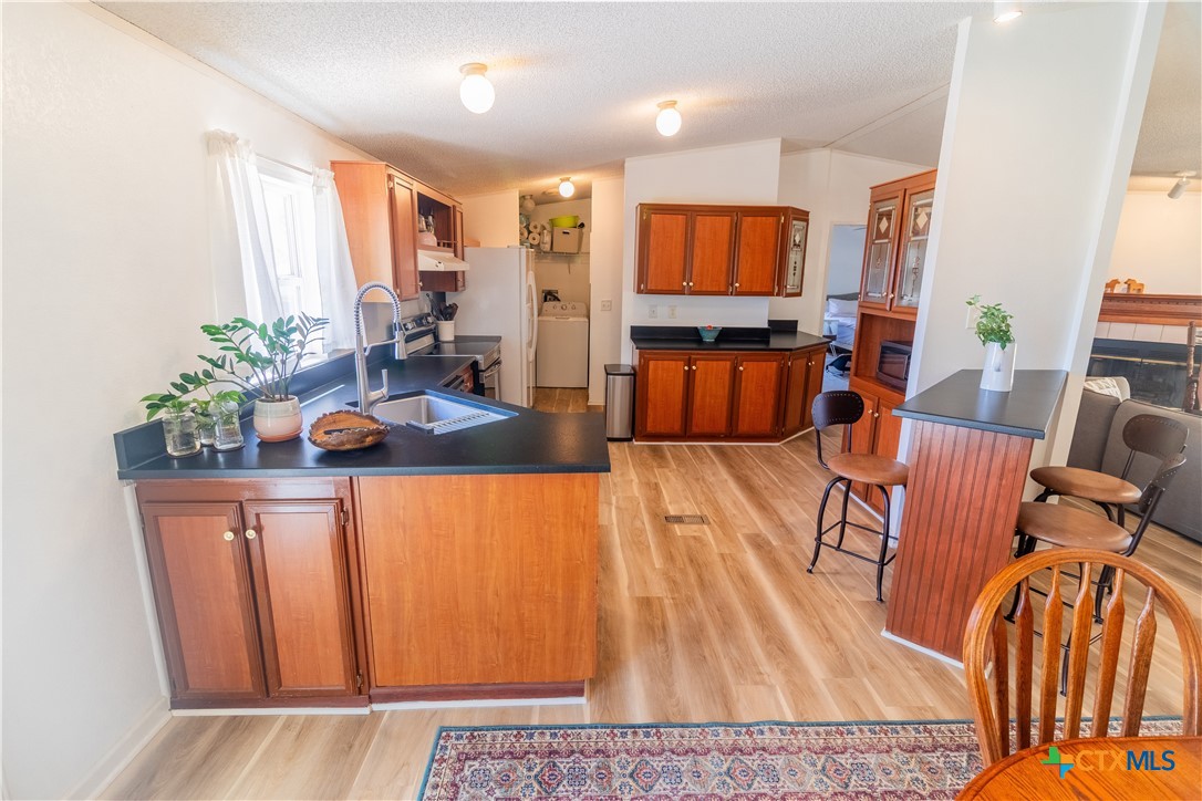 250 Rocky Road Lockhart, TX 78644 - Photo 13 of 45 a living room with furniture kitchen view and large windows