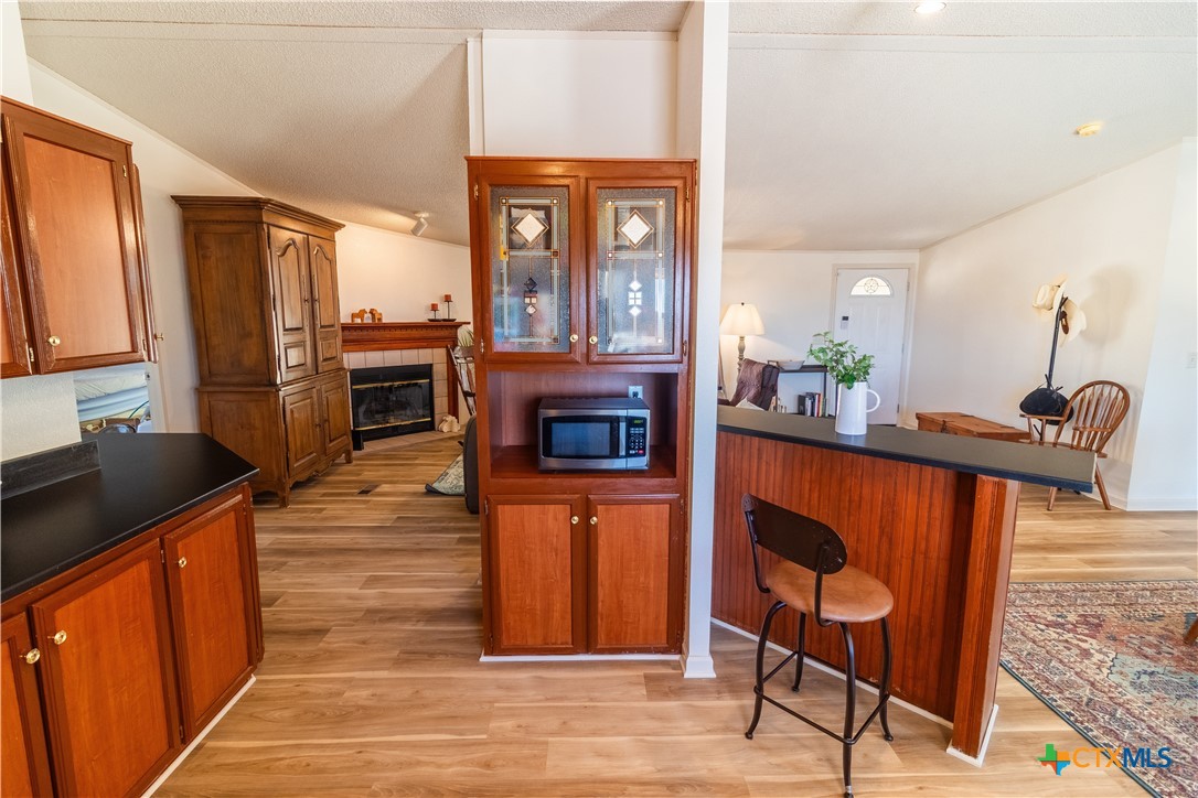 250 Rocky Road Lockhart, TX 78644 - Photo 17 of 45 a kitchen with stainless steel appliances granite countertop a stove a sink and a refrigerator