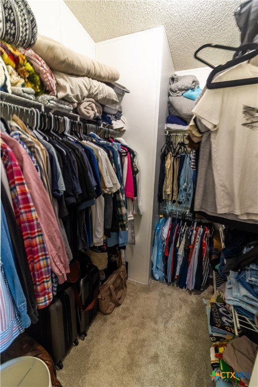 250 Rocky Road Lockhart, TX 78644 - Photo 22 of 45 a view of walk in closet with clothes and shoes