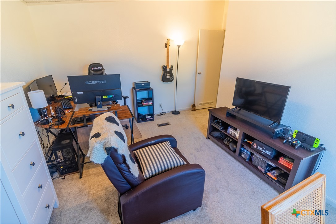 250 Rocky Road Lockhart, TX 78644 - Photo 28 of 45 a living room with furniture and a flat screen tv