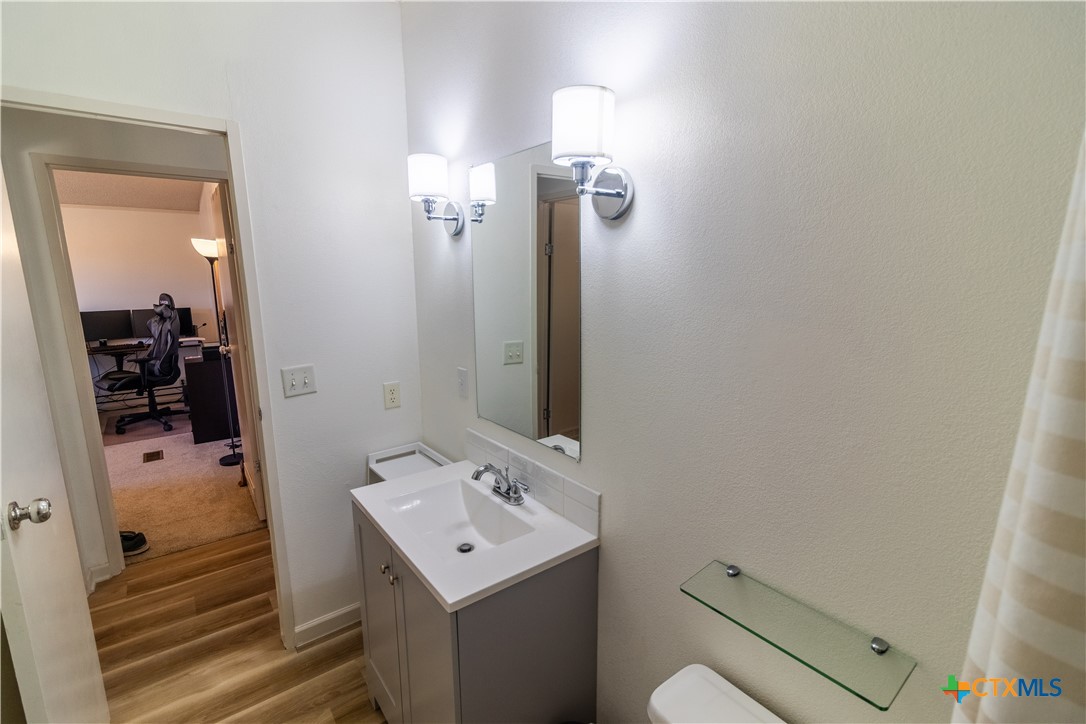 250 Rocky Road Lockhart, TX 78644 - Photo 33 of 45 a bathroom with a sink a toilet and shower