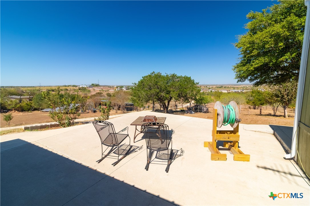 250 Rocky Road Lockhart, TX 78644 - Photo 38 of 45 a view of a swimming pool with an outdoor seating