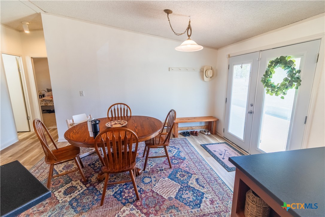 250 Rocky Road Lockhart, TX 78644 - Photo 5 of 45 a view of a dining room with furniture window and wooden floor