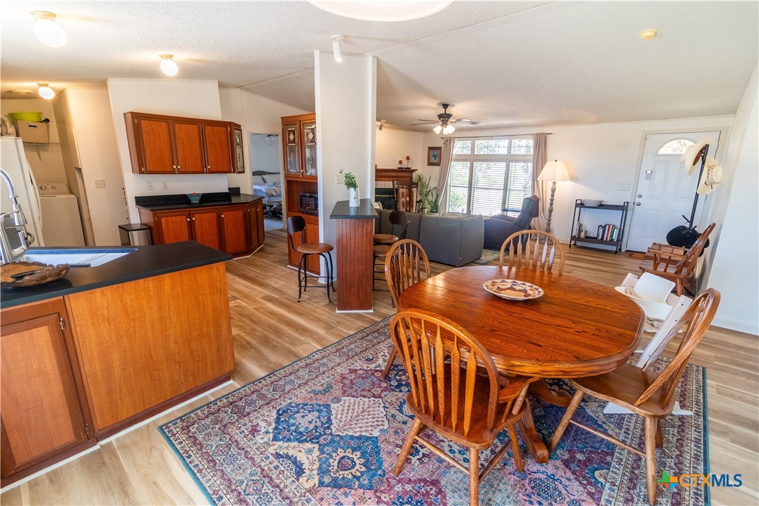 250 Rocky Road Lockhart, TX 78644 - Photo 6 of 45 a dining room with furniture and wooden floor