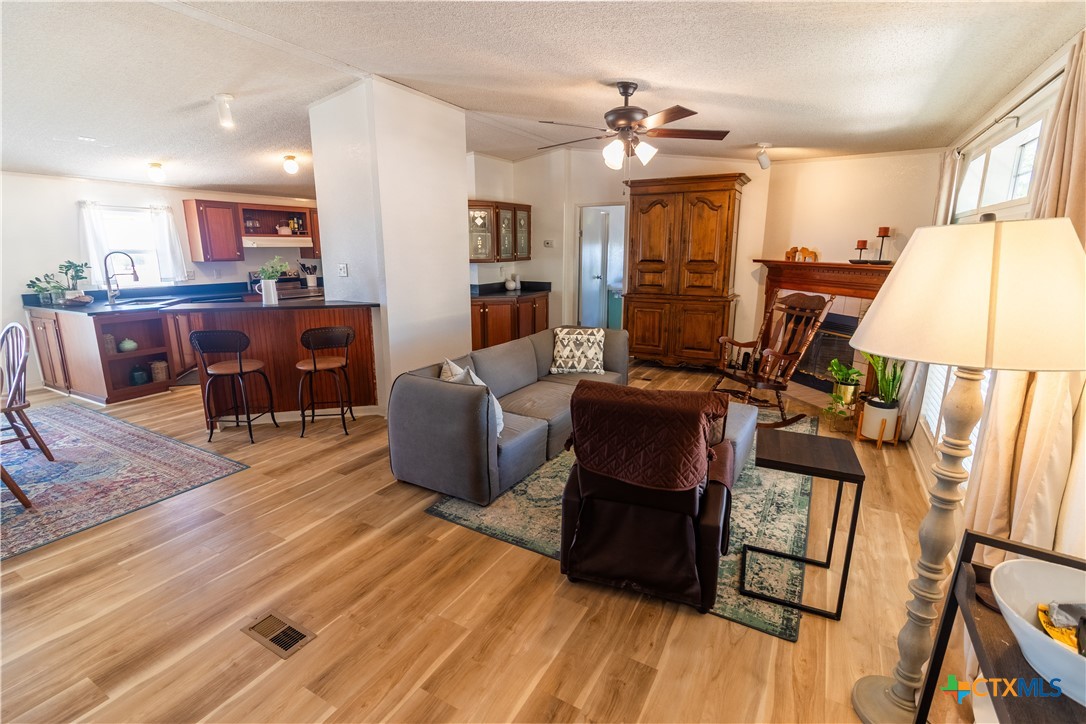 250 Rocky Road Lockhart, TX 78644 - Photo 8 of 45 a living room with furniture and wooden floor