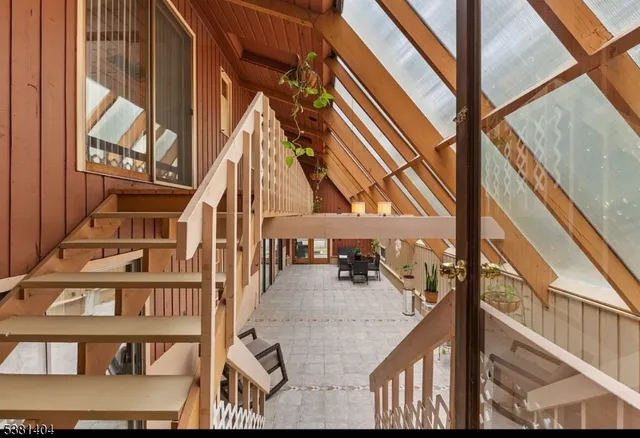 a view of a chairs and table in patio of a house