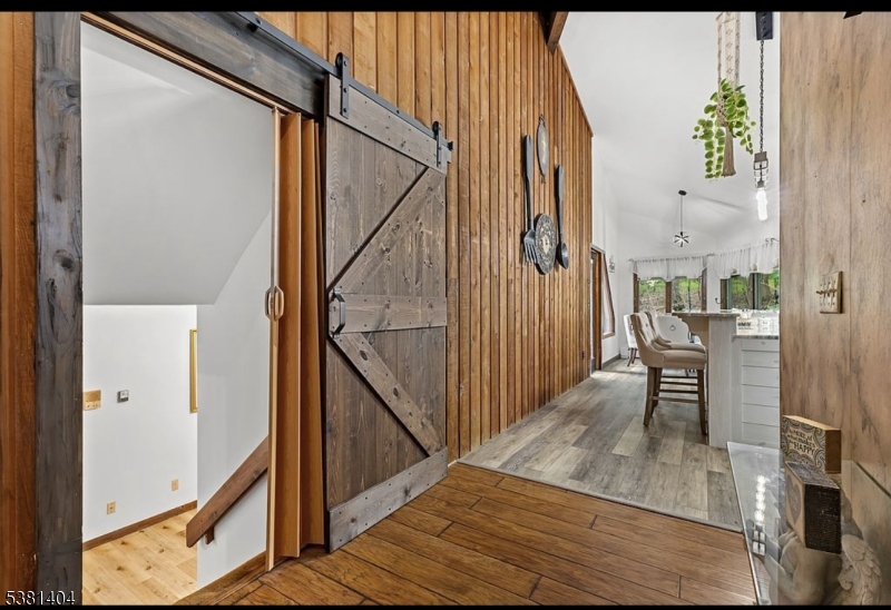 56 Sleepy Hollow Road Andover, NJ 07821 - Photo 17 of 37 a view of a hallway with wooden floor and staircase
