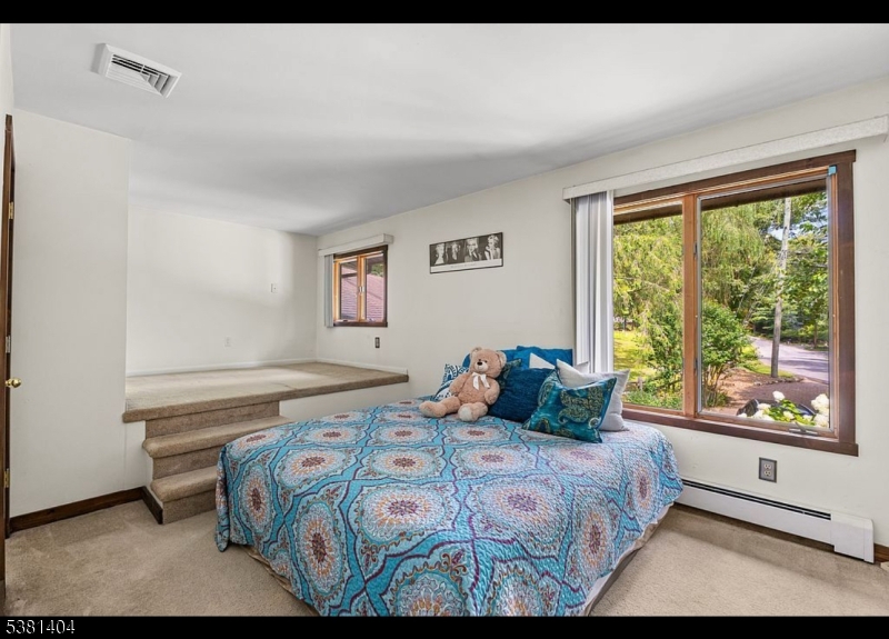 56 Sleepy Hollow Road Andover, NJ 07821 - Photo 22 of 37 a bedroom with a bed and a window