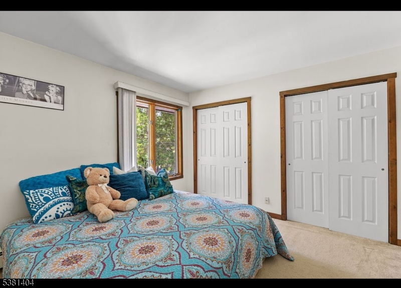 56 Sleepy Hollow Road Andover, NJ 07821 - Photo 23 of 37 a bedroom with a bed and window