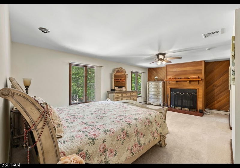 56 Sleepy Hollow Road Andover, NJ 07821 - Photo 26 of 37 a bed sitting in a spacious bedroom next to a window