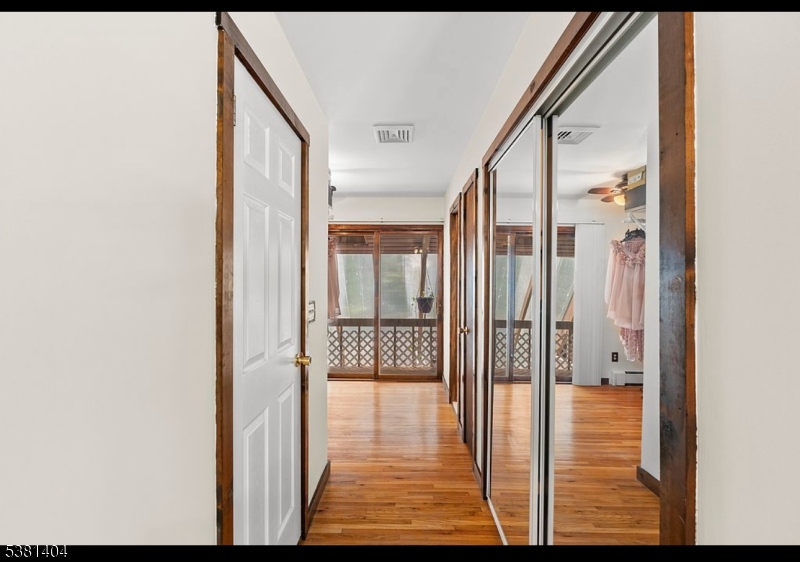 56 Sleepy Hollow Road Andover, NJ 07821 - Photo 29 of 37 a view of a hallway with wooden floor