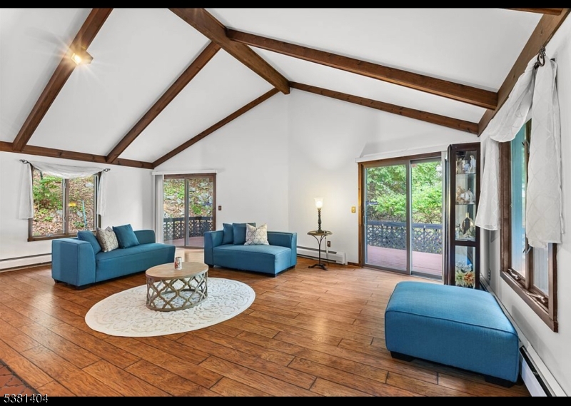 56 Sleepy Hollow Road Andover, NJ 07821 - Photo 3 of 37 a living room with furniture and a large window