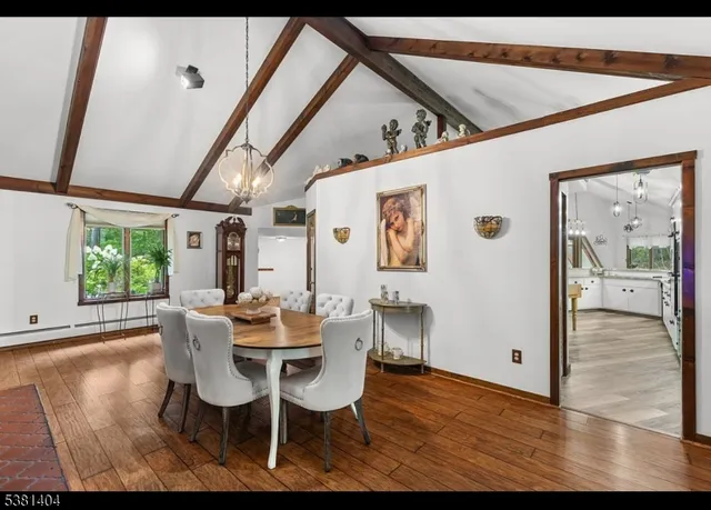 a dining room with furniture and window