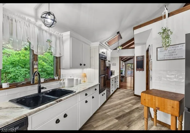 a view of a kitchen with a window