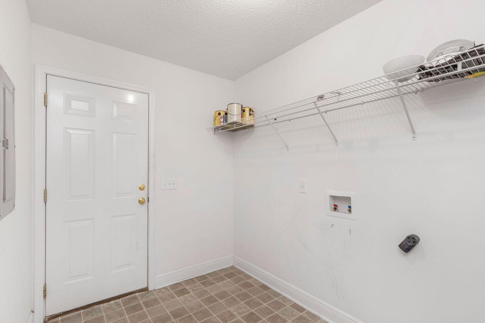 238 Foxchase Way Crestview, FL 32536 - Photo 13 of 33 a view of a room with racks on the wall