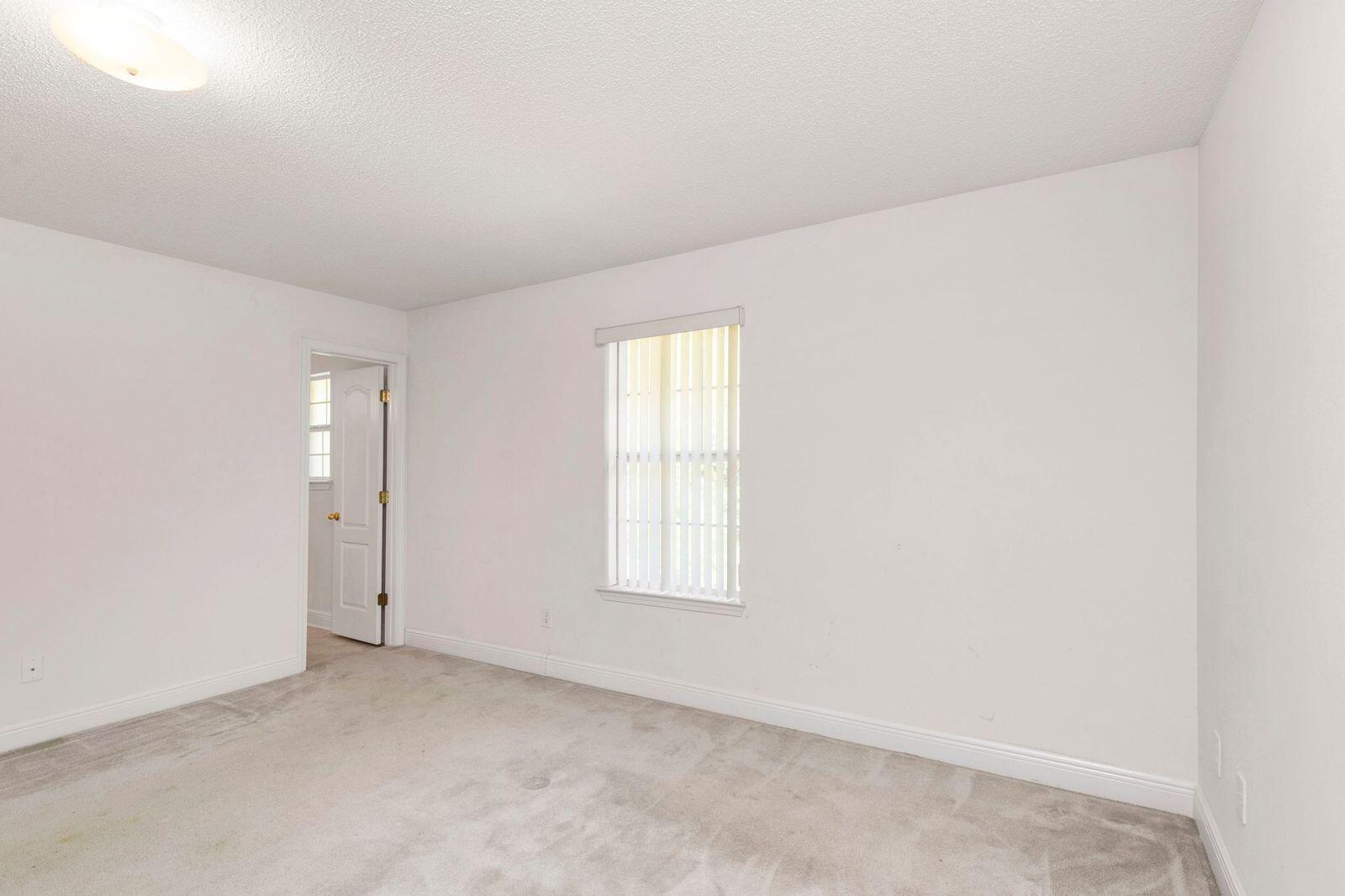 238 Foxchase Way Crestview, FL 32536 - Photo 20 of 33 an empty room with windows and closet