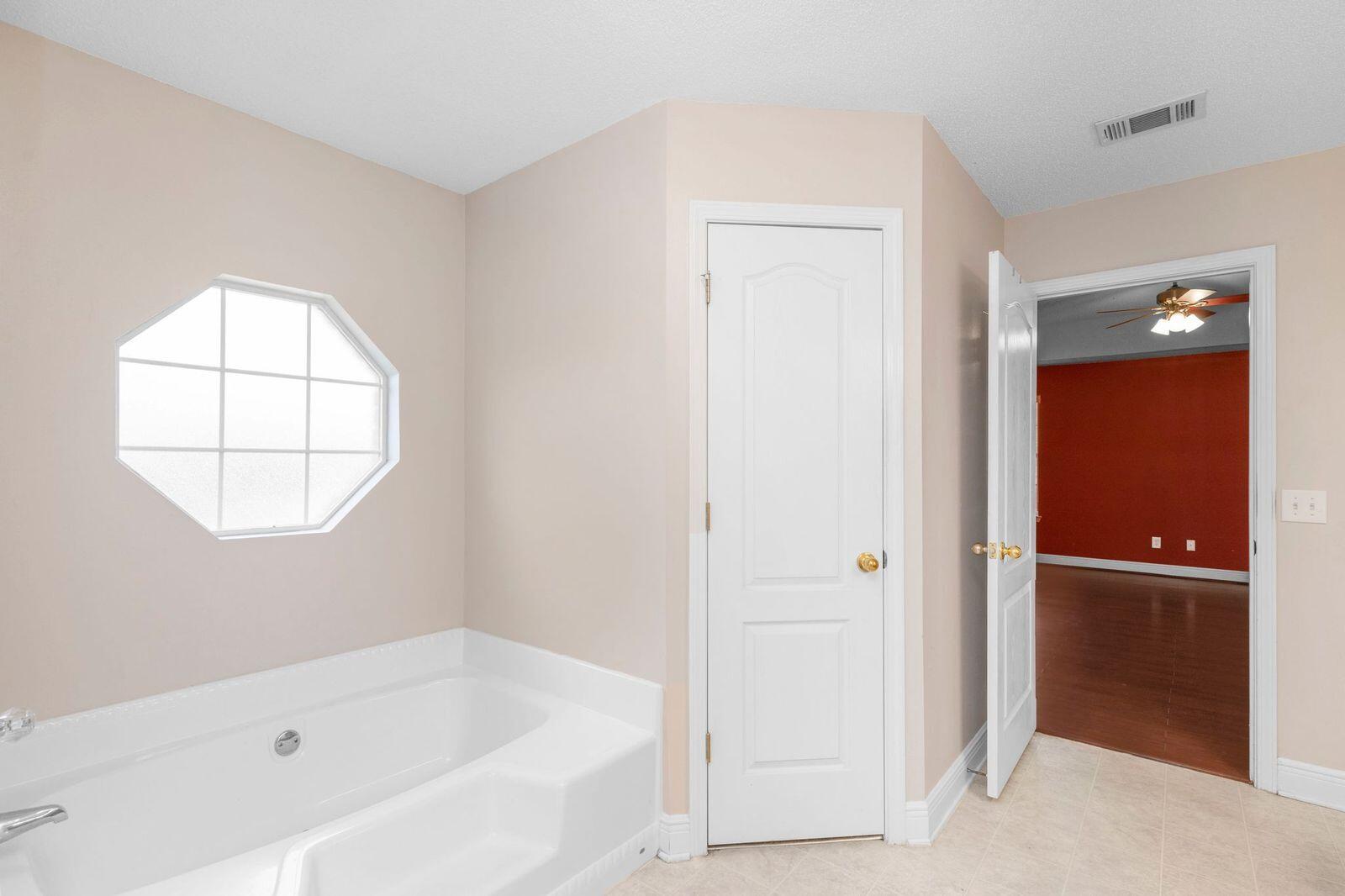 238 Foxchase Way Crestview, FL 32536 - Photo 23 of 33 an empty room with a bathroom and a window