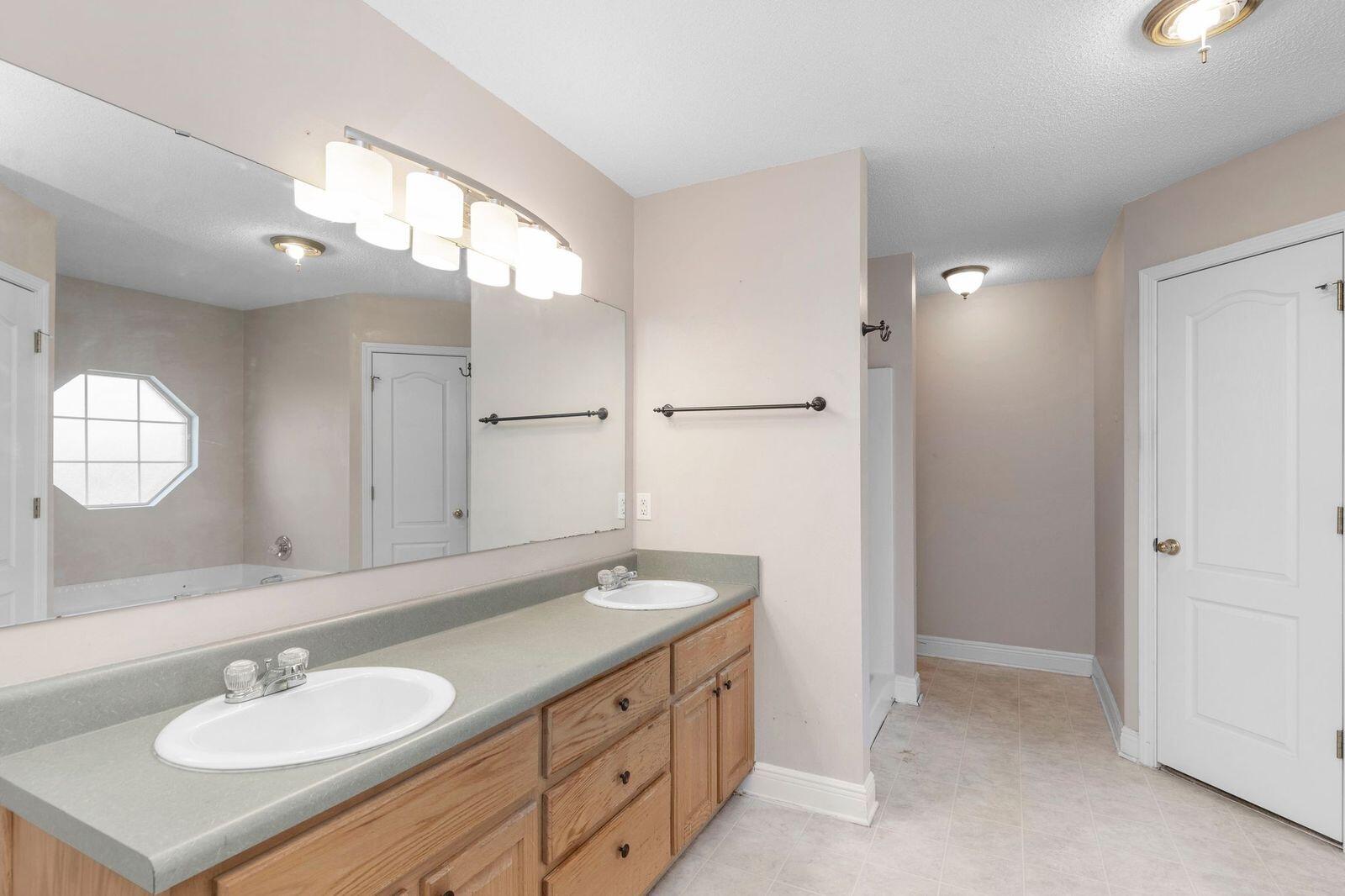 238 Foxchase Way Crestview, FL 32536 - Photo 24 of 33 a bathroom with a sink double vanity and a mirror