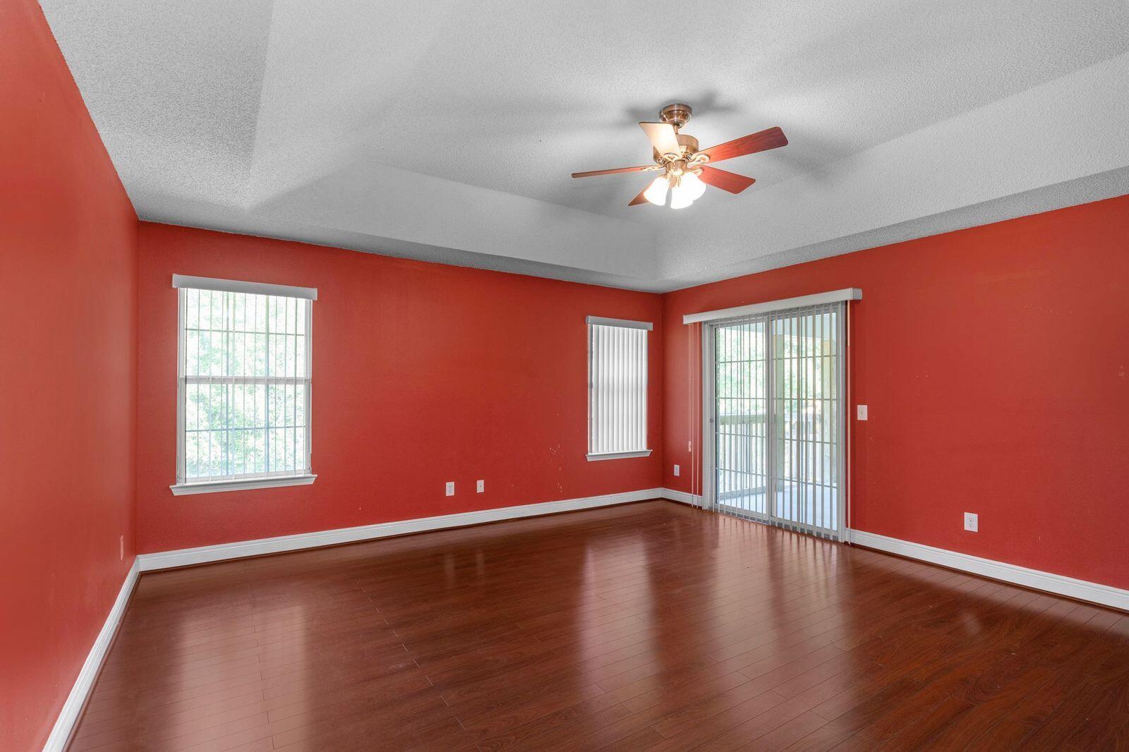 238 Foxchase Way Crestview, FL 32536 - Photo 26 of 33 a view of an empty room with window and wooden floor
