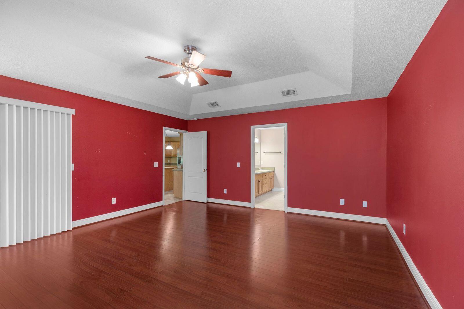 238 Foxchase Way Crestview, FL 32536 - Photo 27 of 33 a view of an empty room with window and wooden floor