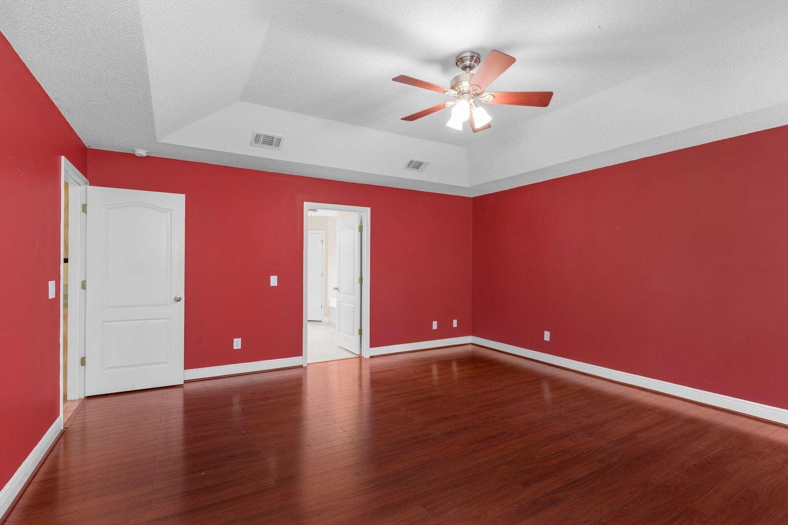 238 Foxchase Way Crestview, FL 32536 - Photo 28 of 33 a view of an empty room with wooden floor