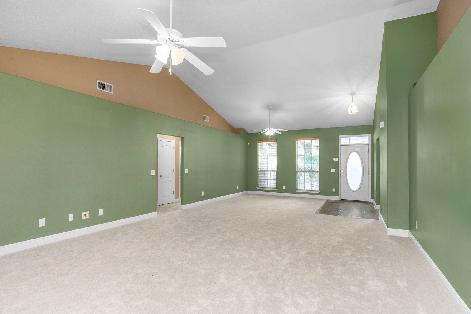 238 Foxchase Way Crestview, FL 32536 - Photo 4 of 33 a view of an empty room with chandelier fan and a window
